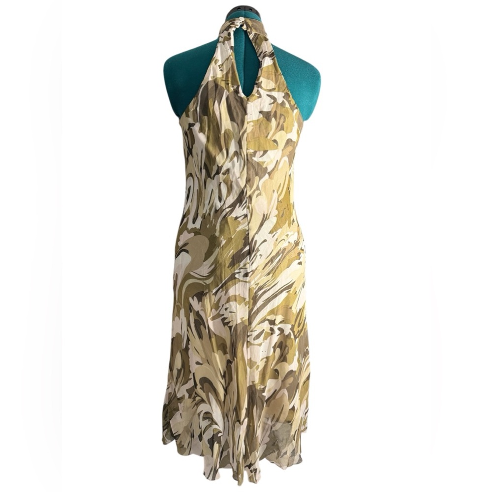 “Chic halter neck dress with a stunning abstract pattern in earthy tones.